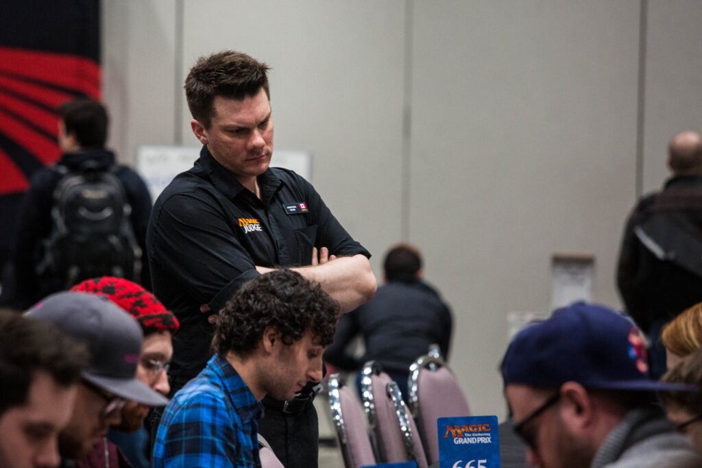 Jon watches a match at MagicFest Toronto in 2018. Photo © John Brian McCarthy