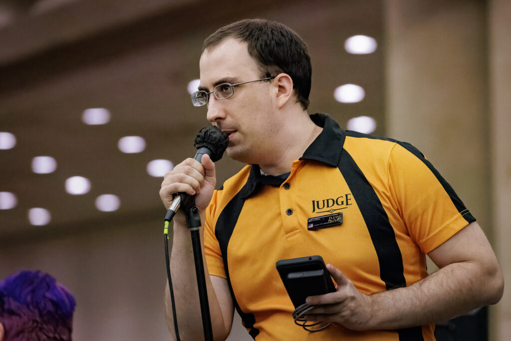 Dan makes announcements at Battle Hardened  Baltimore. Photo © John Brian McCarthy