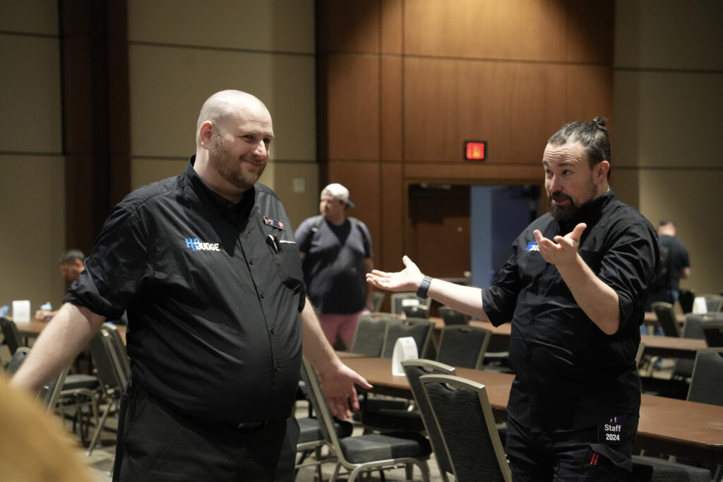 Mike and John discuss an event at the Hunter Burton Memorial Open in 2024. Photo © Jordan Baker