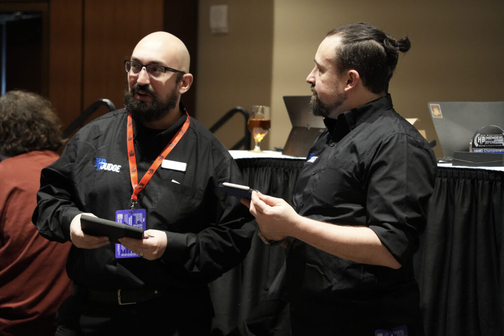 Joe and John discuss a rules question at the Hunter Burton Memorial Open in 2024. Photo © Jordan Baker